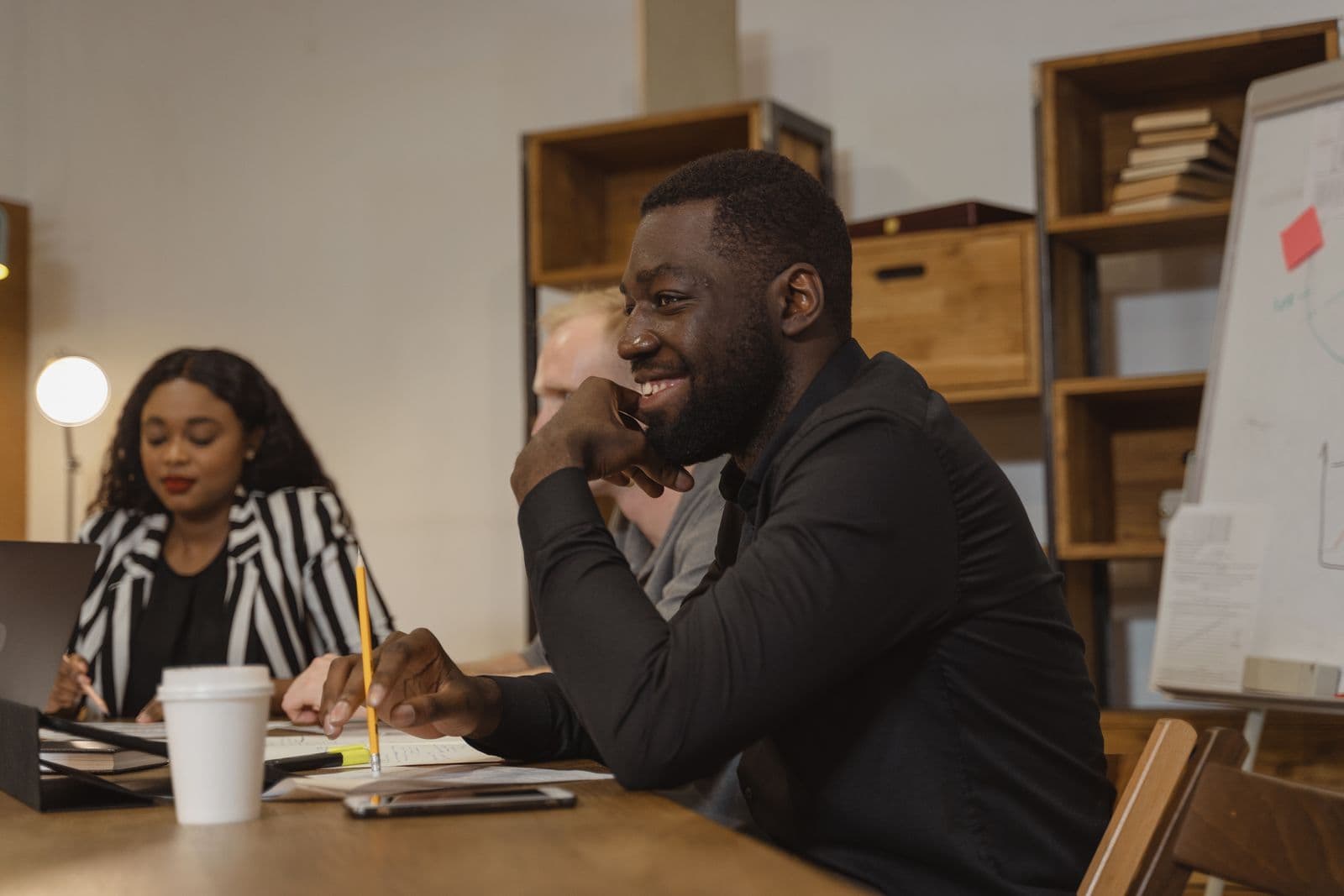 Two professionals in a focused one-to-one coaching conversation
